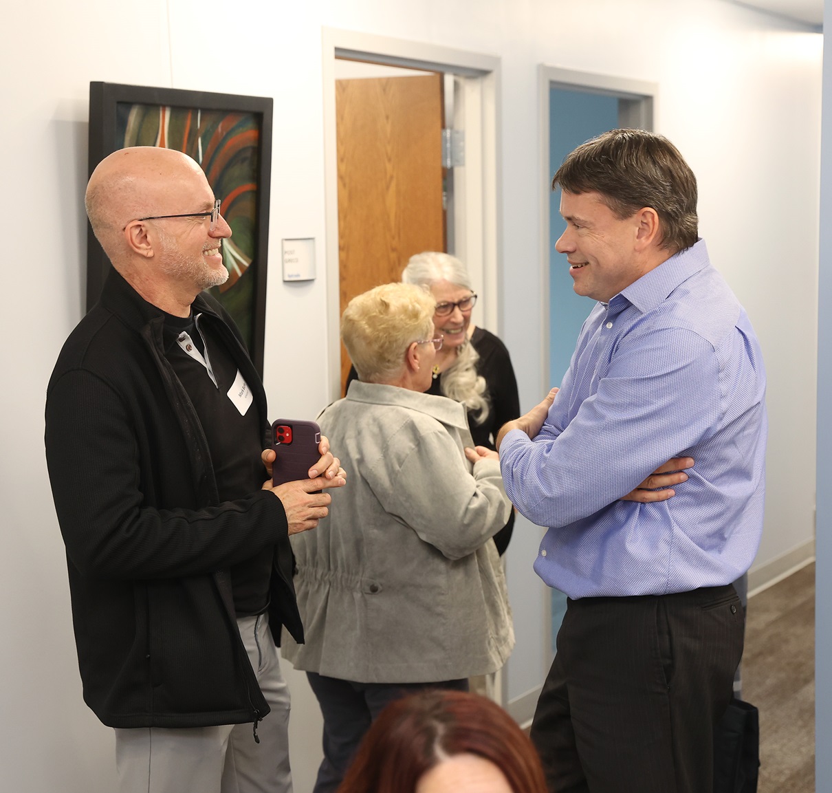 david steele mingling at intrada's open house