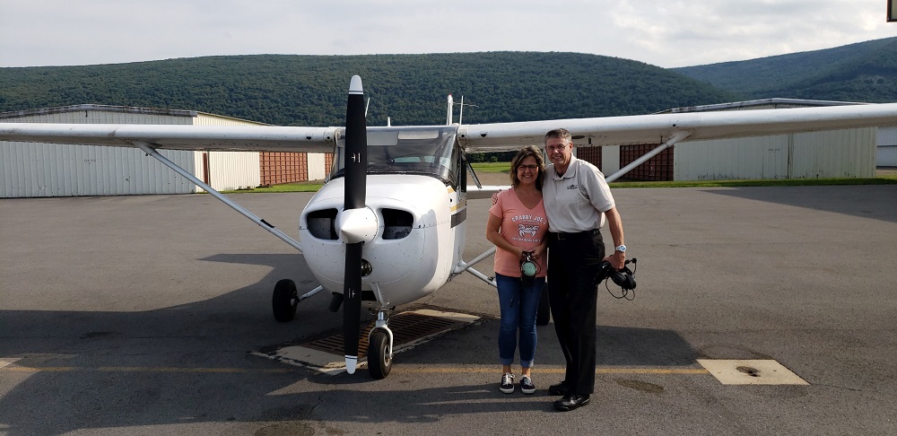 Billie and ret. Col. Hall following her first flying lesson
