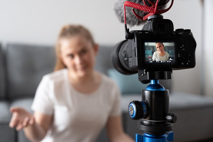 woman using camera to record a video