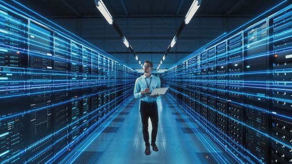 Man walking through a server room